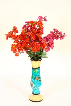 artistic vase with flowers on white background