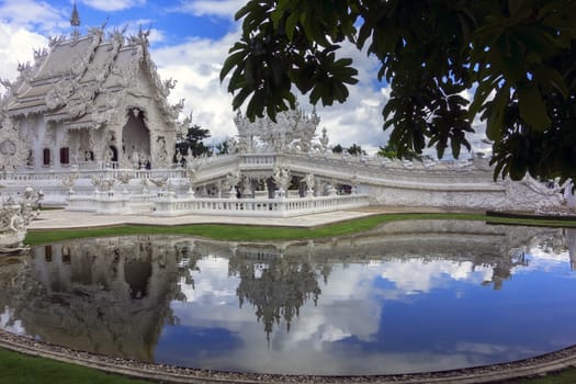 White Temple and Pond. Contemporary unconventional Buddhist temple in Chiang Rai