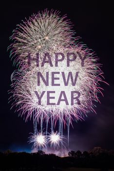 Happy New Year with colorful sparklers. The words Happy New Year are integrated into the fireworks with black background