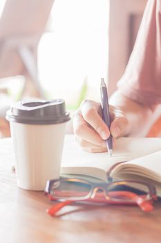 Woman making some important notes, stock photo