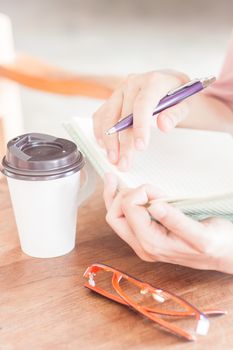 Writing time in coffee shop, stock photo