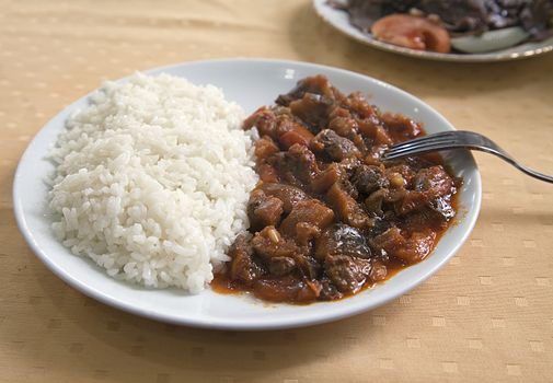 Meat with rice on a plate in a turkish cafe