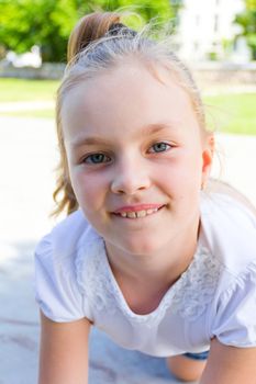 Cute girl with blond long hair and blue eyes