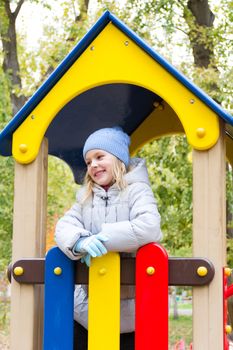 Photo of cute smiling girl in autumn