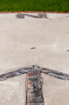 brick paver north arrow compass embedded in concrete