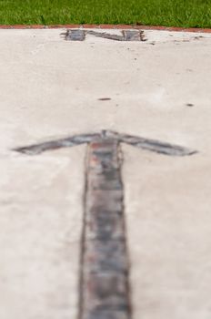 brick paver north arrow compass embedded in concrete