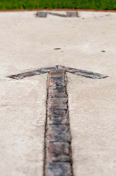 brick paver north arrow compass embedded in concrete
