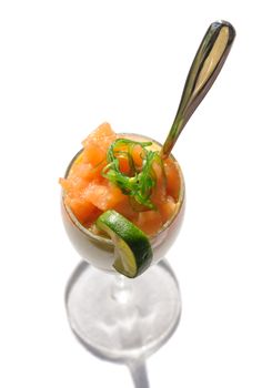 Closeup of a fresh salad with salted salmon and seaweed