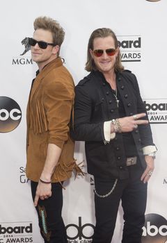 LAS VEGAS - MAY 18 : Florida Georgia Line members Brian Kelley (L) and Tyler Hubbard attend the 2014 Billboard Music Awards at the MGM Grand Garden Arena on May 18 , 2014 in Las Vegas.