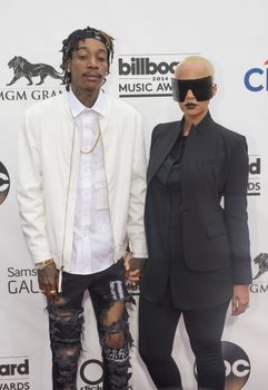 LAS VEGAS - MAY 18 : Rapper Wiz Khalifa (L) and model Amber Rose attend the 2014 Billboard Music Awards at the MGM Grand Garden Arena on May 18 , 2014 in Las Vegas.