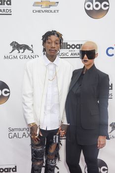 LAS VEGAS - MAY 18 : Rapper Wiz Khalifa (L) and model Amber Rose attend the 2014 Billboard Music Awards at the MGM Grand Garden Arena on May 18 , 2014 in Las Vegas.