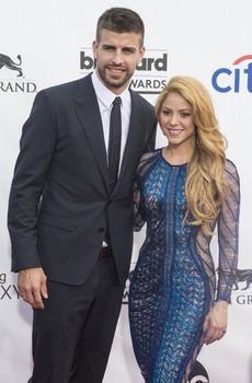 LAS VEGAS - MAY 18 : Soccer player Gerard Pique (L) and recording artist Shakira attend the 2014 Billboard Music Awards at the MGM Grand Garden Arena on May 18 , 2014 in Las Vegas.