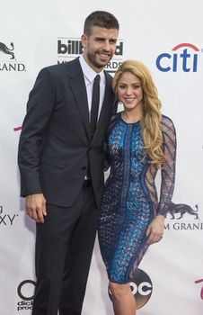 LAS VEGAS - MAY 18 : Soccer player Gerard Pique (L) and recording artist Shakira attend the 2014 Billboard Music Awards at the MGM Grand Garden Arena on May 18 , 2014 in Las Vegas.