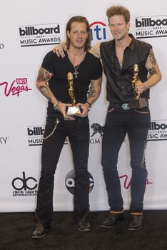 LAS VEGAS - MAY 18 : Florida Georgia Line members Tyler Hubbard and Brian Kelley attend the 2014 Billboard Music Awards press room at the MGM Grand Garden Arena on May 18 , 2014 in Las Vegas.