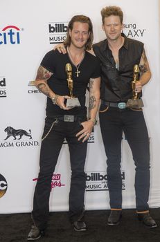 LAS VEGAS - MAY 18 : Florida Georgia Line members Tyler Hubbard and Brian Kelley attend the 2014 Billboard Music Awards press room at the MGM Grand Garden Arena on May 18 , 2014 in Las Vegas.