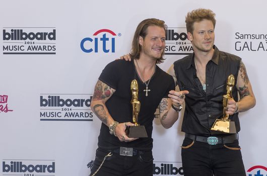 LAS VEGAS - MAY 18 : Florida Georgia Line members Tyler Hubbard and Brian Kelley attend the 2014 Billboard Music Awards press room at the MGM Grand Garden Arena on May 18 , 2014 in Las Vegas.