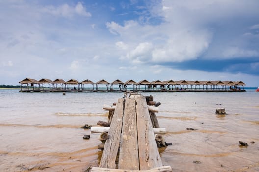 Wood cottage Water and sky in  the Reservoir embankment Sirinthorn Ubonratchatani Thailand