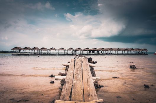 Wood cottage Water and sky in  the Reservoir embankment Sirinthorn Ubonratchatani Thailand vintage