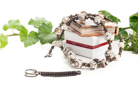 beautiful necklace with box and little book and green leafs