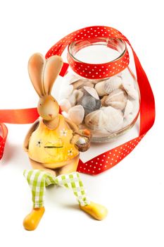 orange bunny with jar of sea clams and red ribbon