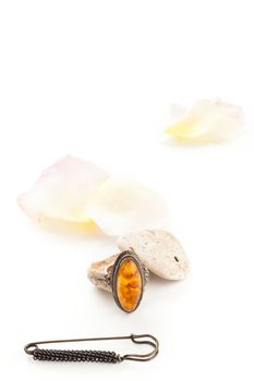 vintage orange ring with stones and rose petals