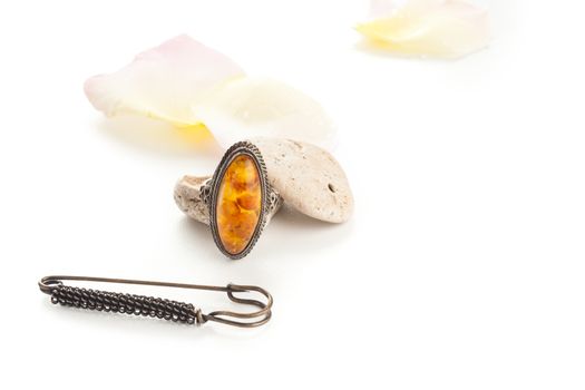 vintage orange ring with stones and rose petals