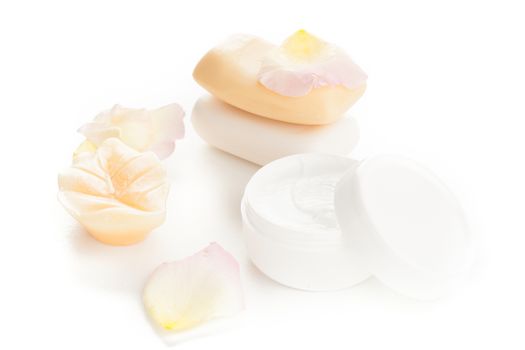 moisturizer beauty cream and soaps with flower petals