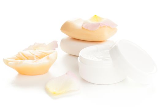 moisturizer beauty cream and soaps with flower petals