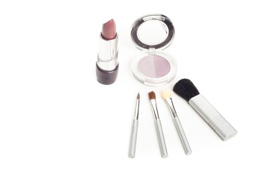 simple facial cosmetics set with lipstick brushes mascara