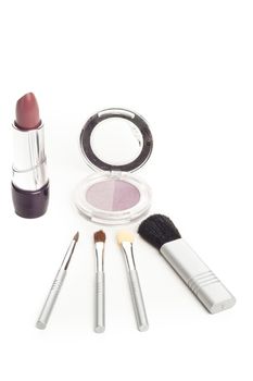 simple facial cosmetics set with lipstick brushes mascara