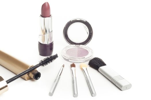 simple facial cosmetics set with lipstick brushes mascara