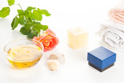 cosmetics healthy aromatherapy herbal oil, candle and rose