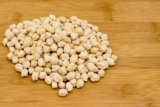 Garbanzo Chickpeas  on a bamboo chopping borad 