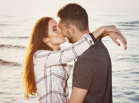 Summer, love. Attractive couple on the beach