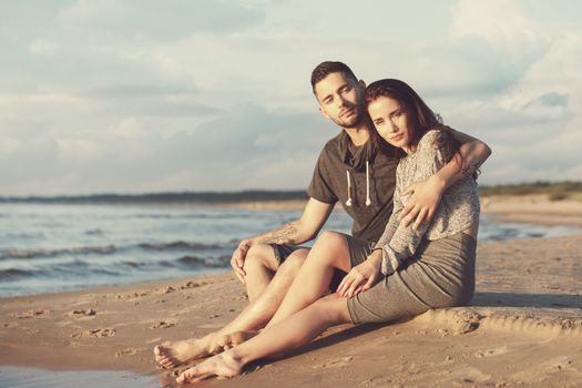Summer, love. Attractive couple on the beach