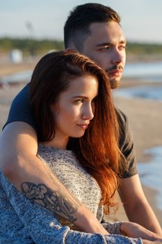 Summer, love. Attractive couple on the beach