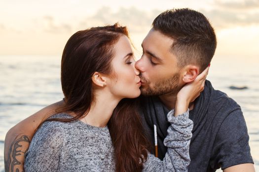 Summer, love. Attractive couple on the beach