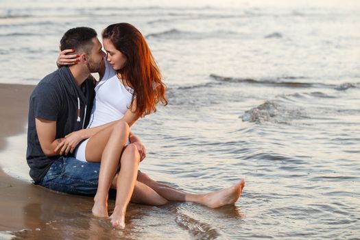 Summer, love. Attractive couple on the beach