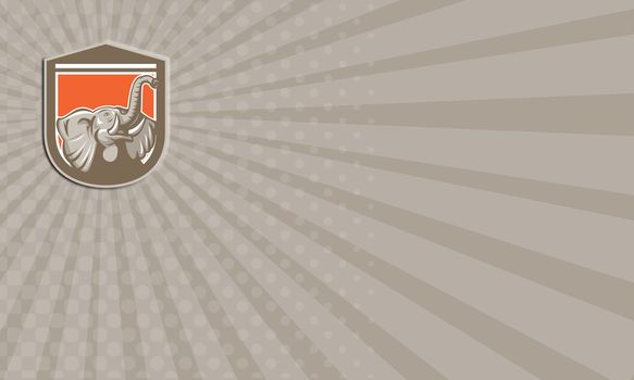 Business card showing illustration of an elephant head with tusk looking up set inside shield crest on isolated background done in retro style.