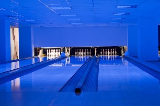 Bowling hall. Bowling bowls in row. Bowling lanes