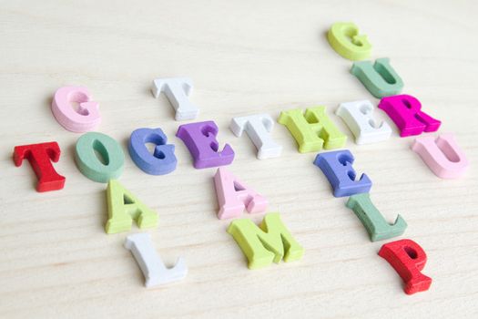 Photo shows a detail of the crossword puzzle funny sign with symbols on a table.