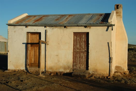Decaying architecture at sunset on a farm in the Northern Cape Province of South Africa
