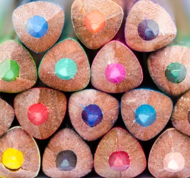 Macro detail of colorful pencils in a stack with no background