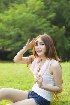 Woman sitting rest after exercise Inside the park