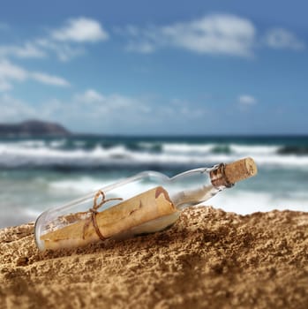 Message in the bottle on island seashore beach sand