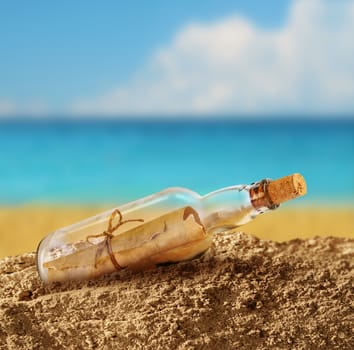 Message in the bottle on seashore beach sand