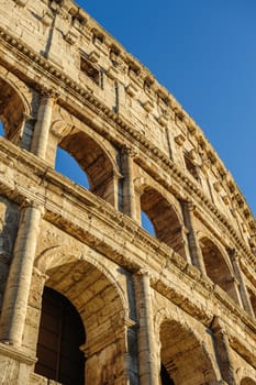 Partial view of ancient Rome Coliseum ruins. Italy, Rome.