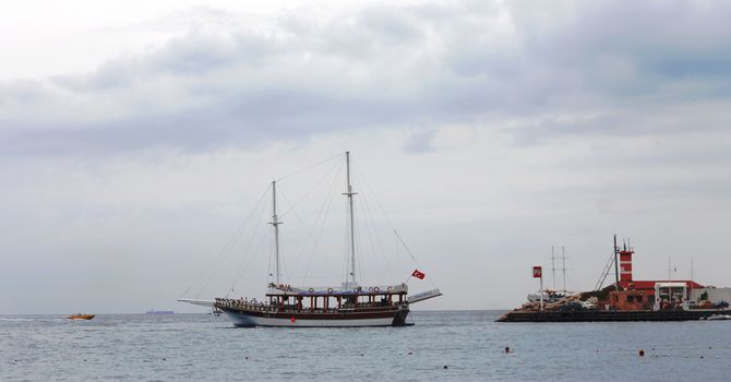Sail ship moving away from the shore