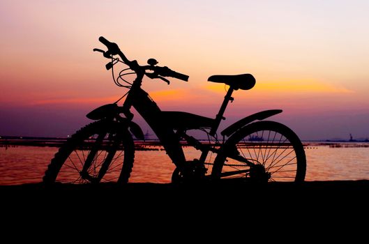 Mountain bike silhouette with sunset sky, Thailand