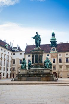 VIENNA, AUSTRIA - AUGUST 4, 2013: Hofburg Palace courtyard with Emperor Franz I sculpture monument, Vienna, Austria.